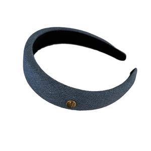 Blue denim sponge headband with gold metal logo tag for elegant vintage hairstyle look