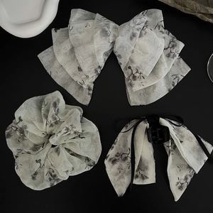 Detail of Zen-style chiffon hair accessories set with ink floral print and calligraphy
