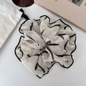 French style oversized scrunchie with cream translucent fabric and black stroke patterns