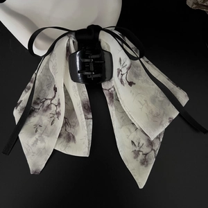 Close-up of ink painting ribbon bow hair claw clip with elegant calligraphy details