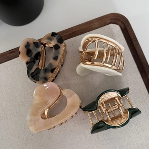 Set of four irregular metal hair claws with tortoise and marble acetate finishes