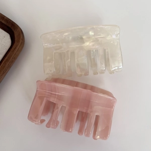Elegant large acetic acid hair claws in creamy white and lotus pink marble texture
