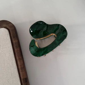 Irregular dark green marble acetic hair claw clip with wave design and golden metal spring
