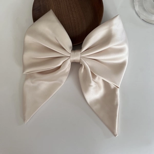 Elegant large champagne satin bow hair clip with long ribbons for French style hairdo