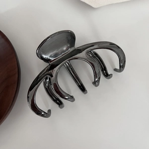 Pince à cheveux noire métallique élégante pour cheveux épais avec finition brillante