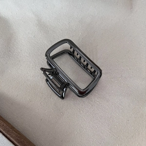 Minimalist square black metal hair claw clip with glossy finish for elegant hair styling