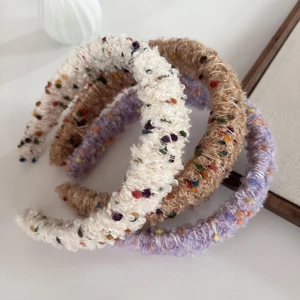 Colorful knitted bean headbands in cream white, light purple, and camel fuzzy fleece