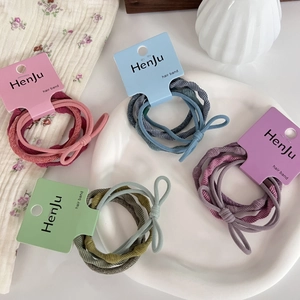 Set of 4 high-elastic colorful hair bands with simple bows on decorative display