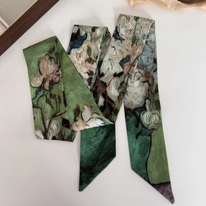 Detailed macro view of oil painting style silk twilly scarf with iris floral patterns