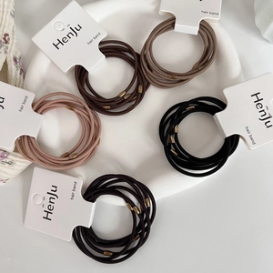 Durable elastic hair ties set with bronze oval beads in five versatile earth-tone colors