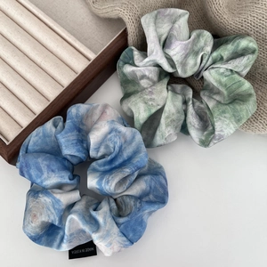 Elegant satin scrunchies with artistic oil painting marble patterns in blue and green hues