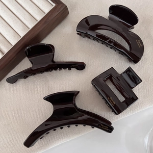 Set of 4 vintage dark brown acetate hair claws with high gloss and gold French lettering