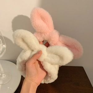 Soft plush bunny ear headbands in pink and white for facial cleansing and skincare