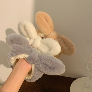 Three plush bunny ear headbands in grey white and khaki for face washing