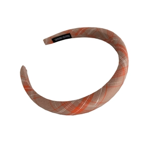 Chic orange and beige plaid sponge headband for women with a handmade woven label