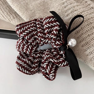 Elegant tweed scrunchie with a black satin bow and large pearl pendant in 45-degree view