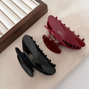 Glossy acetate shark hair clips in black and wine red colors with gold handmade lettering