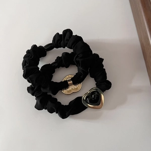 Set of two black scrunchies with elegant gold heart pendants for women hair styling