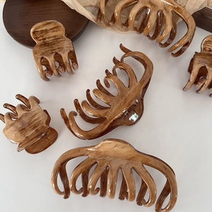 Set of large French style wood grain hair claws in various elegant amber resin shapes