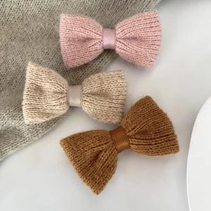 Three-piece knitted bow hair clips in pink, beige, and caramel soft autumn wool
