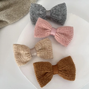 Knitted bow hair clips set in grey, pink, beige, and caramel soft wool texture