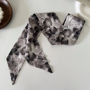 Detail of French vintage floral silk hair scarf with elegant black ink flower patterns
