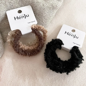 Three-piece plush hair scrunchie set in coffee and black colors with brand tags