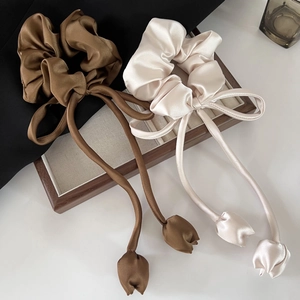 Elegant satin scrunchies with long ribbons and fabric tulip pendants in brown and champagne