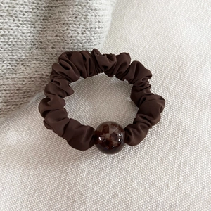 Minimalist leopard print hair scrunchie in coffee brown with decorative marble resin bead