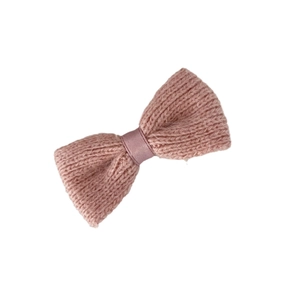 Sweet knitted bow hair clip in dusty rose with soft texture and satin center ribbon