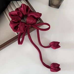 Elegant burgundy satin scrunchie featuring long streamers and fabric tulip charm details