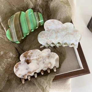 Cloud acetate hair claw set in green and marble colors for elegant hairstyling