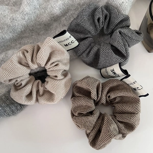 Herringbone fabric scrunchies set in beige, grey and coffee brown colors for women