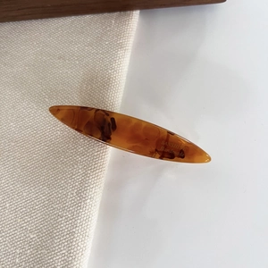 Handmade amber tortoiseshell hair clip in a streamlined design for women