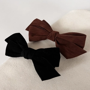 Elegant multi-layered bow hair clip set in matte black and dark chocolate brown fabric
