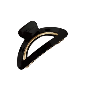 Minimalist black acetate semi-circle hair claw clip with golden metal inner teeth