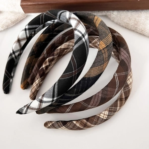 Detail shot of vintage plaid headbands in various autumn brown and khaki color patterns