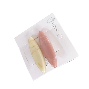 Pair of minimalist candy color oval hair clips in beige and dusty pink marble acetate