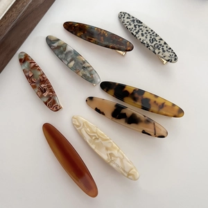 Set of 8 minimalist acetate hair clips in assorted tortoiseshell and marble patterns