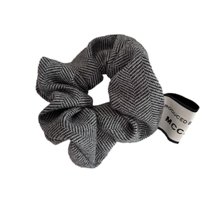 French minimalist herringbone wool scrunchie in grey and black with branded fabric label