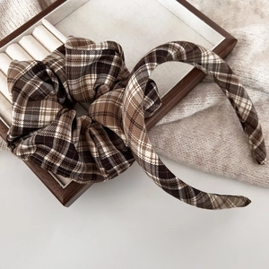 Detail of vintage brown plaid headband and matching scrunchie on wood tray