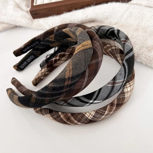 Classic plaid fabric headbands in brown and gray tones for autumn and winter season