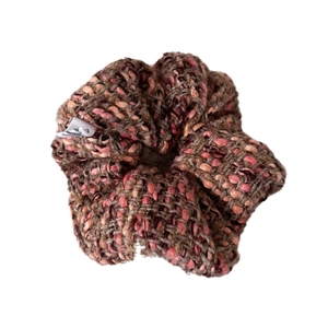 Pink and brown tweed knit scrunchie with soft plaid pattern for elegant hair styling