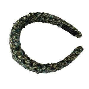 Handmade chunky knitted hairband in mixed green wool with woven Hand Made label