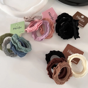 Set of 4 colorful pleated ruffle hair scrunchies with elastic knitted fabric texture