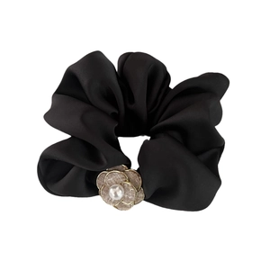 Elegant black satin hair scrunchie with camellia flower, tweed fabric, and pearl accent