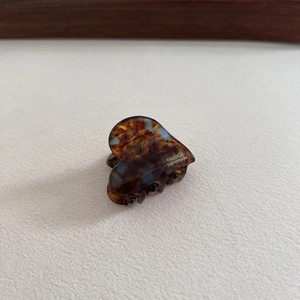 Handmade acetate heart hair claw clip with tortoise shell pattern and golden lettering