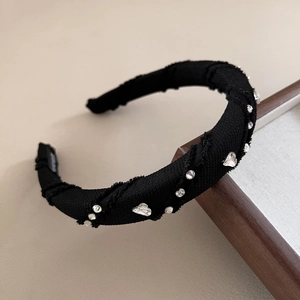 Elegant black wide headband with sparkling rhinestones and heart crystals on wood frame