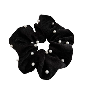 Elegant black velvet scrunchie with white pearls for a vintage retro ponytail style