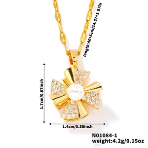 Detailed view of rotating windmill pendant with white pearl and micro-inlaid zircons